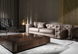 furniture: "TURNER SOFA" SOFA WITH STRUCTURE IN POPLAR WOOD AND FOAM. UPHOLSTERY IN FABRIC OR LEATHER FROM THE COLLECTION WITH ARMS AND BACK IN CAPITONNé WITH METAL PLATES AVAILABLE IN ALL THE FINISHINGS FROM THE COLLECTION. BASE IN METAL AVAILABLE IN BRUSHED FINISH | ARCHONTIKIS - ROBERTO CAVALLI